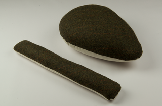 a dark green tweed tailor's ham and sleeve roll